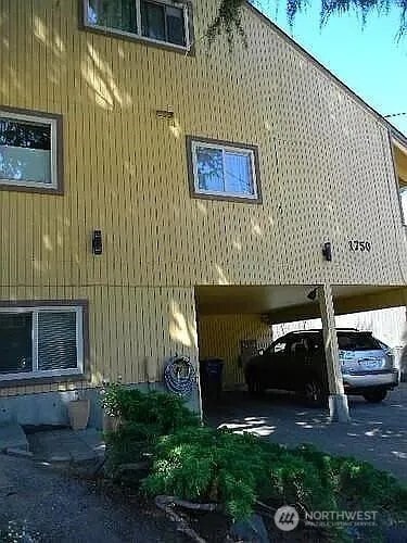 1750 NW 58th St, Seattle, WA 09107 - view of side of home with a carport