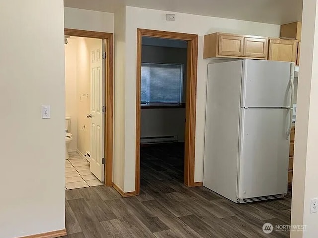 1750 NW 58th St, Seattle, WA 09107 - kitchen featuring freestanding refrigerator, a baseboard radiator, dark wood-style flooring, and light brown cabinetry