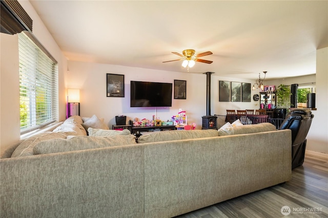 1390 Jordan Ct, Oak Harbor, WA 98277 - living room featuring wood finished floors, a wood stove, and a ceiling fan
