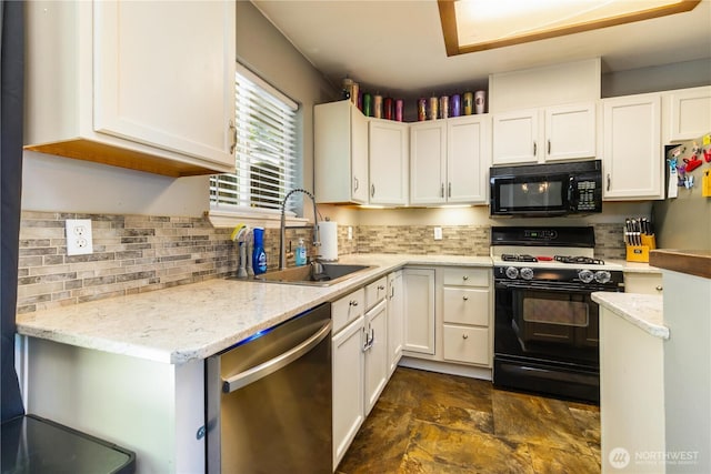 1390 Jordan Ct, Oak Harbor, WA 98277 - kitchen featuring black appliances, white cabinetry, backsplash, stone finish floors, and light stone countertops