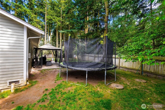 1390 Jordan Ct, Oak Harbor, WA 98277 - fenced backyard with a trampoline and a gazebo