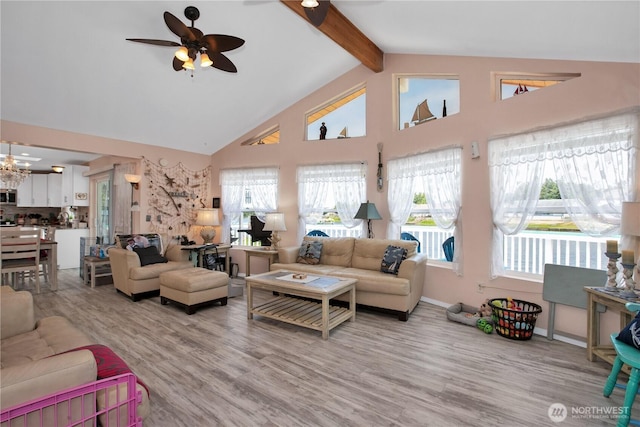 118 Ocean Lake Way NE, Ocean Shores, WA 98569 - living area featuring ceiling fan, beam ceiling, high vaulted ceiling, light wood-type flooring, and a chandelier
