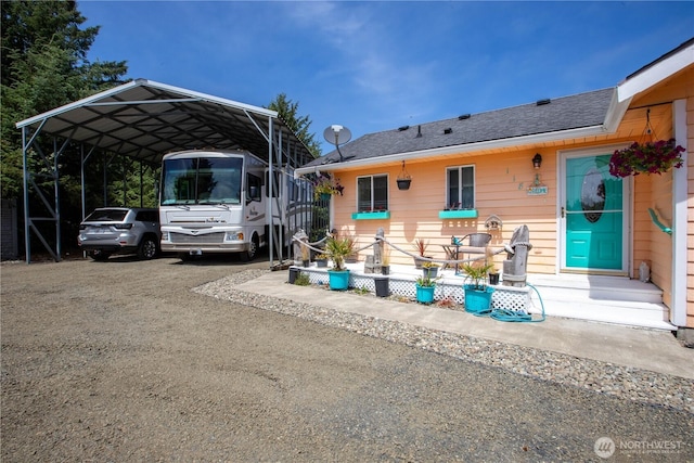 118 Ocean Lake Way NE, Ocean Shores, WA 98569 - view of parking featuring a detached carport