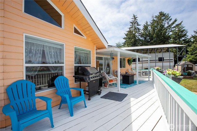 118 Ocean Lake Way NE, Ocean Shores, WA 98569 - deck featuring area for grilling and a storage shed
