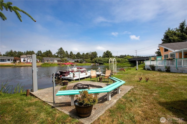 118 Ocean Lake Way NE, Ocean Shores, WA 98569 - view of grassy yard featuring a water view and an outdoor fire pit