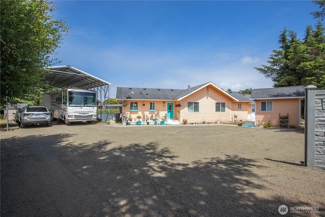 118 Ocean Lake Way NE, Ocean Shores, WA 98569 - view of front of house featuring a detached carport and asphalt driveway