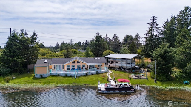 118 Ocean Lake Way NE, Ocean Shores, WA 98569 - rear view of property with a yard, a deck with water view, and boat lift