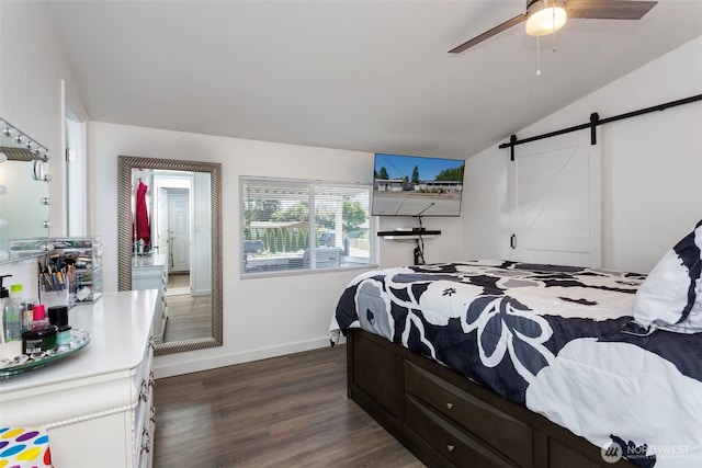 207 6th St, Sultan, WA 98294 - bedroom featuring dark wood finished floors, a barn door, lofted ceiling, and a ceiling fan