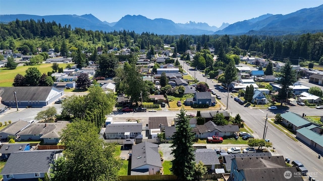 207 6th St, Sultan, WA 98294 - aerial perspective of suburban area featuring a mountain backdrop