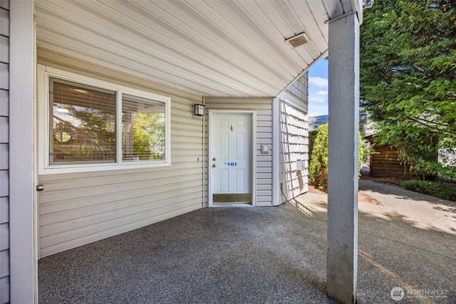 11130 SE 208th St Unit N101, Kent, WA 98031 - view of exterior entry featuring a patio area