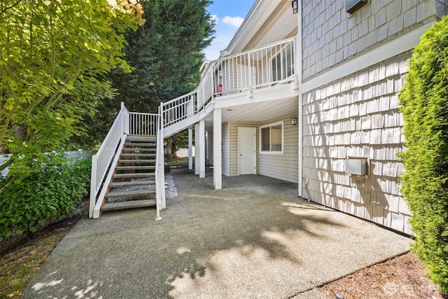 11130 SE 208th St Unit N101, Kent, WA 98031 - view of home's exterior featuring stairway, a patio, and a wooden deck