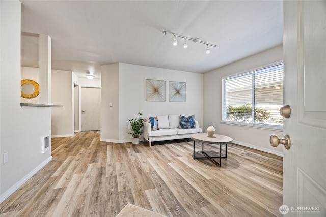 11130 SE 208th St Unit N101, Kent, WA 98031 - living area with wood finished floors and track lighting