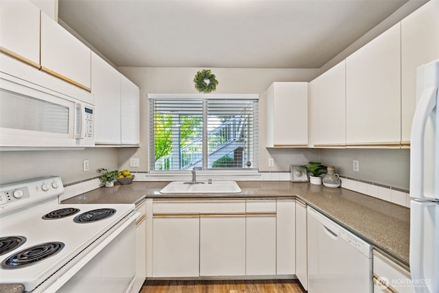 11130 SE 208th St Unit N101, Kent, WA 98031 - kitchen with white appliances and white cabinetry