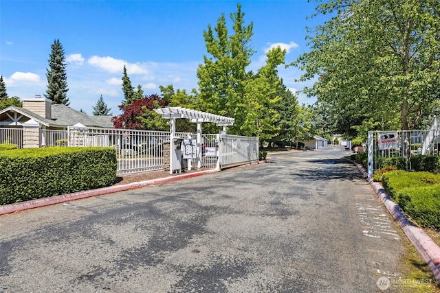 11130 SE 208th St Unit N101, Kent, WA 98031 - view of asphalt street featuring curbs and a gated entry