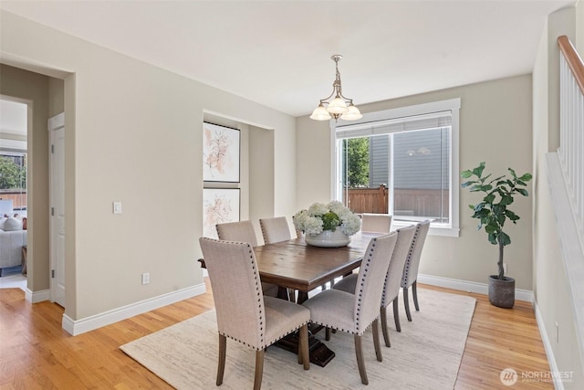 2648 116th Ave NE, Bellevue, WA 98004 - dining area featuring plenty of natural light, light wood-style flooring, and a chandelier