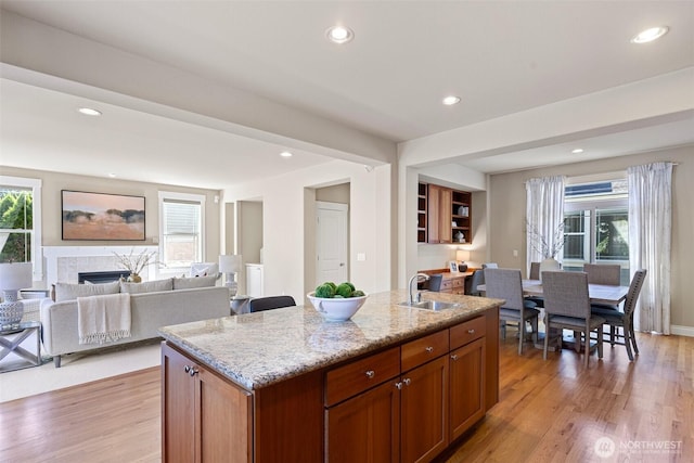 2648 116th Ave NE, Bellevue, WA 98004 - kitchen featuring light stone counters, open floor plan, light wood-type flooring, and recessed lighting