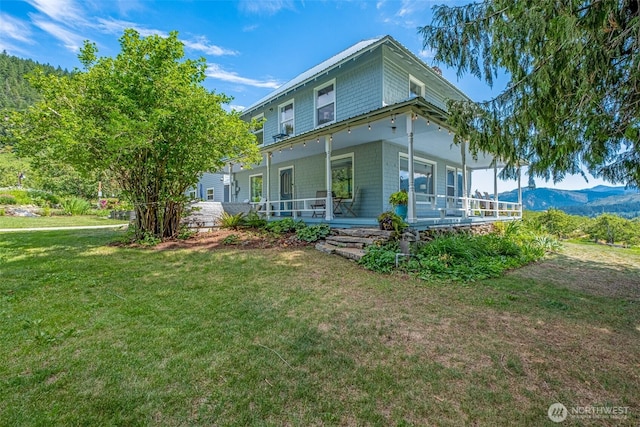9753 Nibbelink Rd, Peshastin, WA 98847 - view of front of home featuring a front lawn, covered porch, and a mountain view