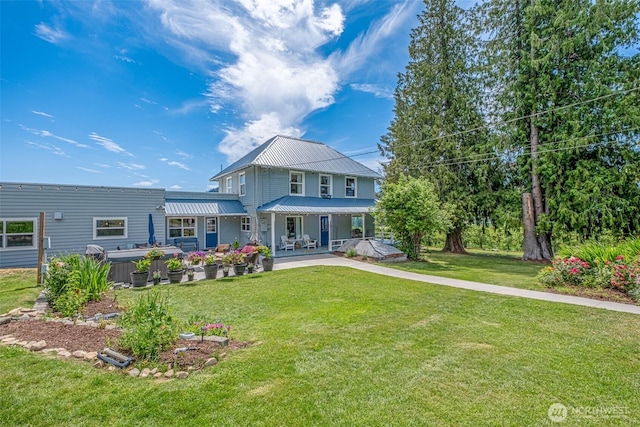 9753 Nibbelink Rd, Peshastin, WA 98847 - back of property with a lawn, a metal roof, and a porch
