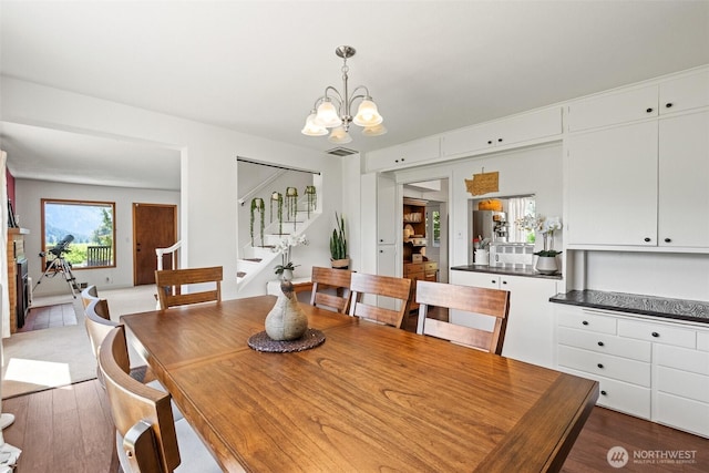 9753 Nibbelink Rd, Peshastin, WA 98847 - dining space featuring stairway and a chandelier
