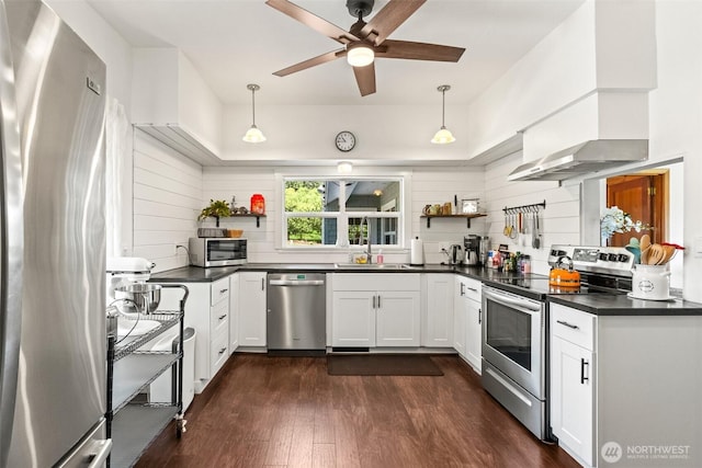 9753 Nibbelink Rd, Peshastin, WA 98847 - kitchen featuring stainless steel appliances, open shelves, dark countertops, dark wood-style floors, and ceiling fan