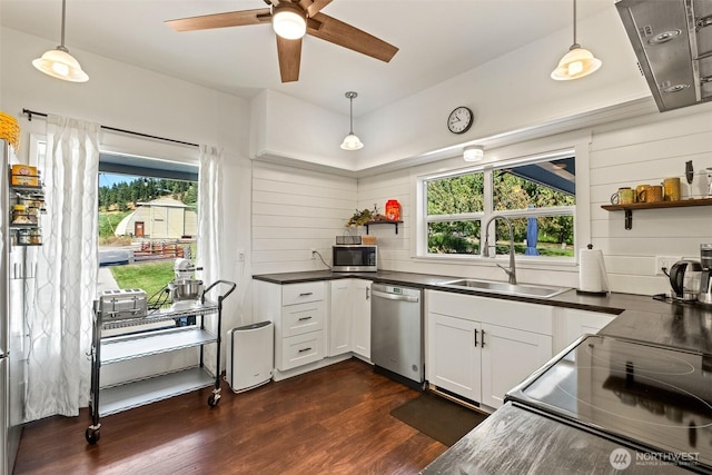 9753 Nibbelink Rd, Peshastin, WA 98847 - kitchen with stainless steel appliances, dark countertops, dark wood-style flooring, open shelves, and hanging light fixtures