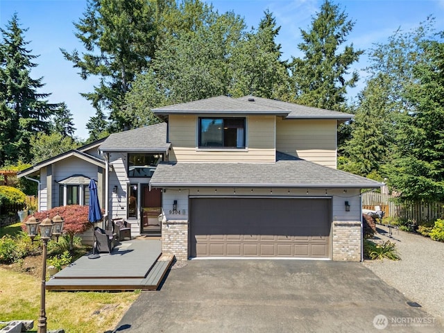9304 Farwest Dr SW, Tacoma, WA 98498 - view of front facade featuring a garage, asphalt driveway, a shingled roof, and brick siding