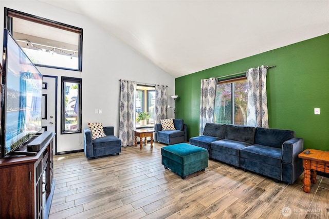 9304 Farwest Dr SW, Tacoma, WA 98498 - living room featuring wood finished floors and high vaulted ceiling