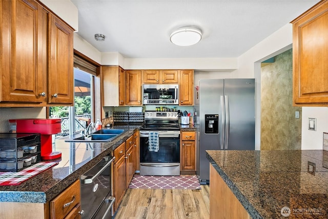 9304 Farwest Dr SW, Tacoma, WA 98498 - kitchen with stainless steel appliances, tile counters, and brown cabinetry