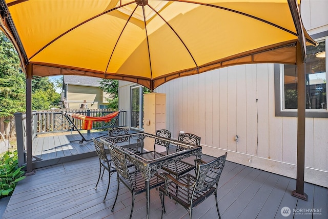 9304 Farwest Dr SW, Tacoma, WA 98498 - deck featuring a gazebo and outdoor dining space