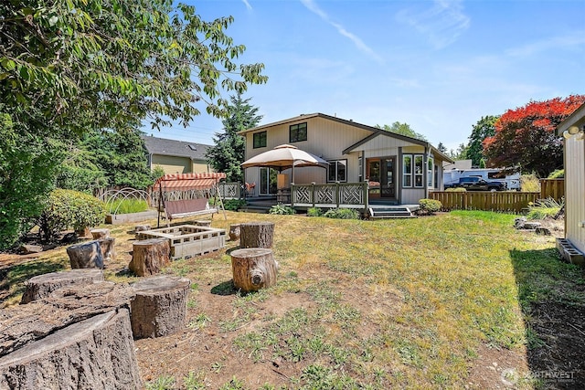 9304 Farwest Dr SW, Tacoma, WA 98498 - rear view of property featuring a vegetable garden, a wooden deck, and a gazebo