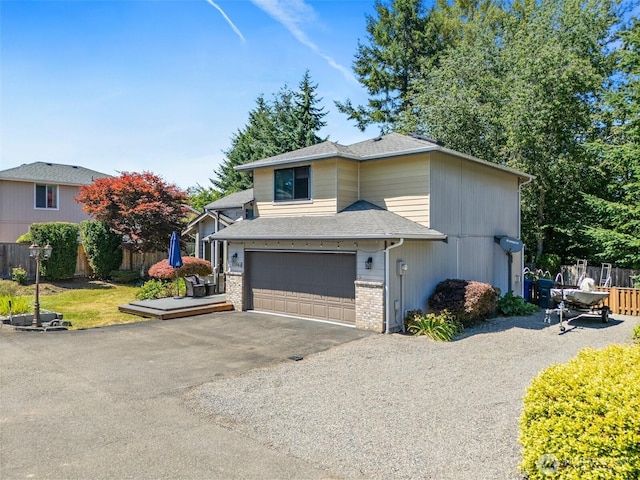 9304 Farwest Dr SW, Tacoma, WA 98498 - view of front of property featuring asphalt driveway, a garage, brick siding, and roof with shingles
