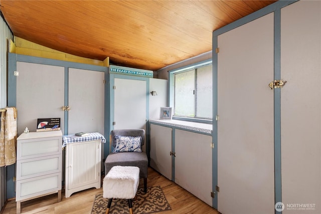 1402 301st Pl, Ocean Park, WA 98640 - sitting room featuring wood ceiling, lofted ceiling, and light wood-style floors