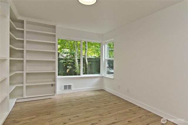 11811 93rd Ln NE Unit 102, Kirkland, WA 98034 - unfurnished room featuring wood finished floors and baseboards