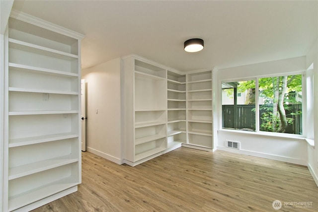 11811 93rd Ln NE Unit 102, Kirkland, WA 98034 - empty room with wood finished floors and baseboards