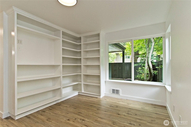 11811 93rd Ln NE Unit 102, Kirkland, WA 98034 - empty room with wood finished floors and baseboards