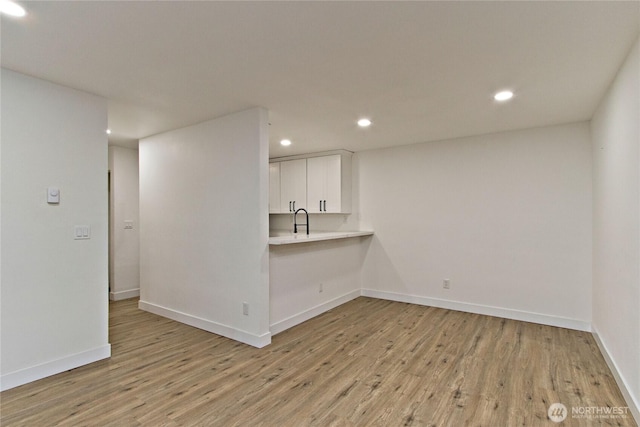 11811 93rd Ln NE Unit 102, Kirkland, WA 98034 - spare room featuring light wood-style floors and recessed lighting