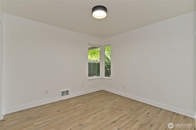 11811 93rd Ln NE Unit 102, Kirkland, WA 98034 - spare room with light wood-type flooring and baseboards