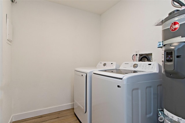 11811 93rd Ln NE Unit 102, Kirkland, WA 98034 - laundry area with washing machine and clothes dryer and light wood finished floors