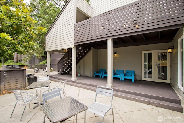 11811 93rd Ln NE Unit 102, Kirkland, WA 98034 - view of patio featuring french doors, stairs, and a deck