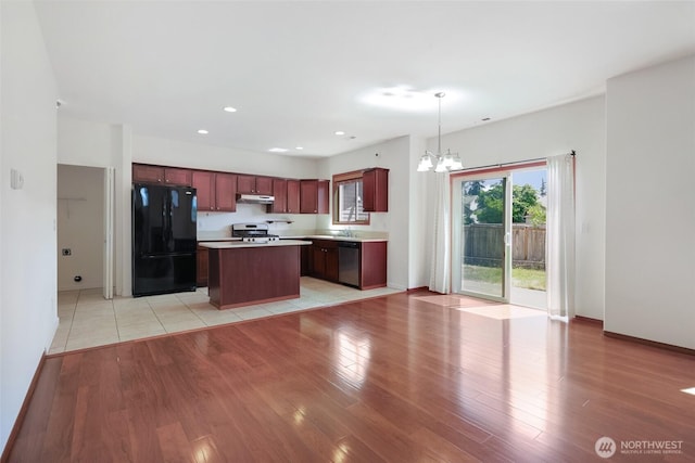 8305 54th Ct SE, Lacey, WA 98513 - kitchen featuring stainless steel appliances, under cabinet range hood, a chandelier, light wood-style floors, and recessed lighting