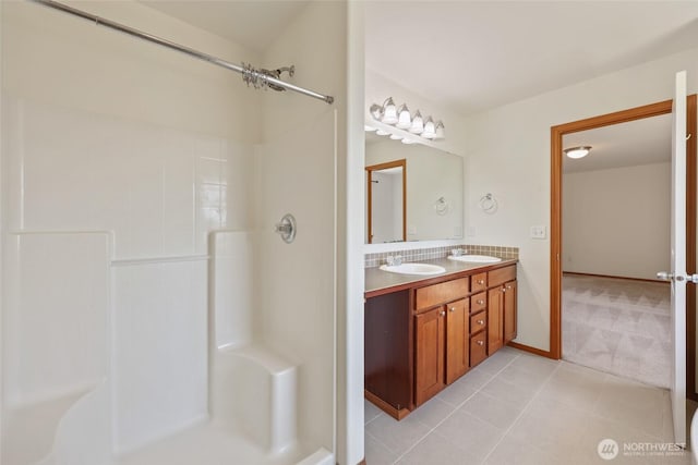8305 54th Ct SE, Lacey, WA 98513 - bathroom featuring double vanity, a shower, and tile patterned floors