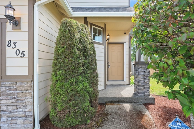 8305 54th Ct SE, Lacey, WA 98513 - entrance to property with a shingled roof and stone siding