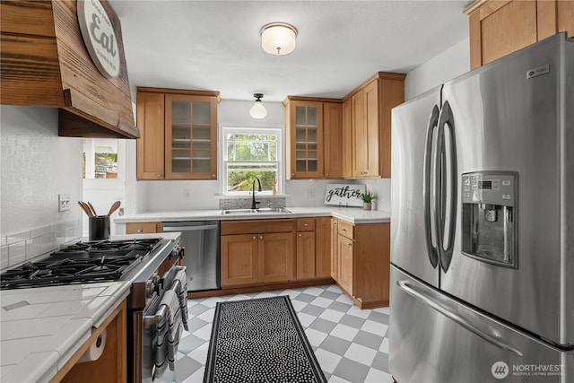 34226 42nd Ave S, Auburn, WA 98001 - kitchen with appliances with stainless steel finishes, light floors, tile counters, glass insert cabinets, and brown cabinetry