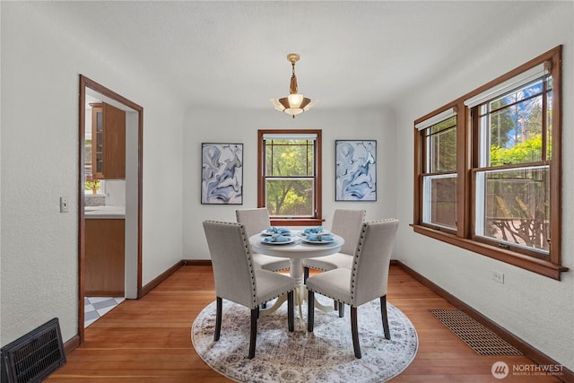 34226 42nd Ave S, Auburn, WA 98001 - dining room featuring light wood-type flooring and a textured wall
