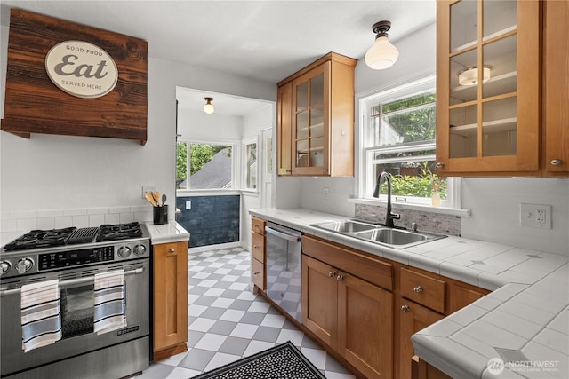 34226 42nd Ave S, Auburn, WA 98001 - kitchen featuring stainless steel appliances, light flooring, healthy amount of natural light, and brown cabinetry