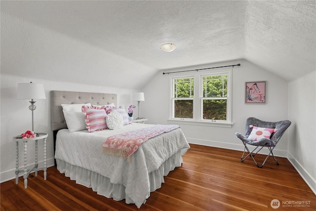 34226 42nd Ave S, Auburn, WA 98001 - bedroom featuring a textured ceiling, wood finished floors, and lofted ceiling