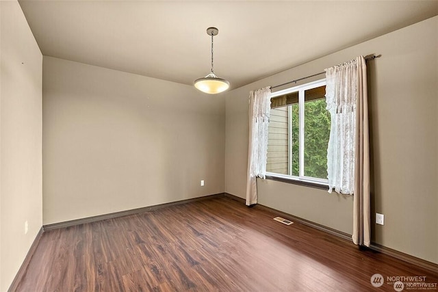 16908 61st St NW, Vaughn, WA 98394 - empty room featuring dark wood finished floors