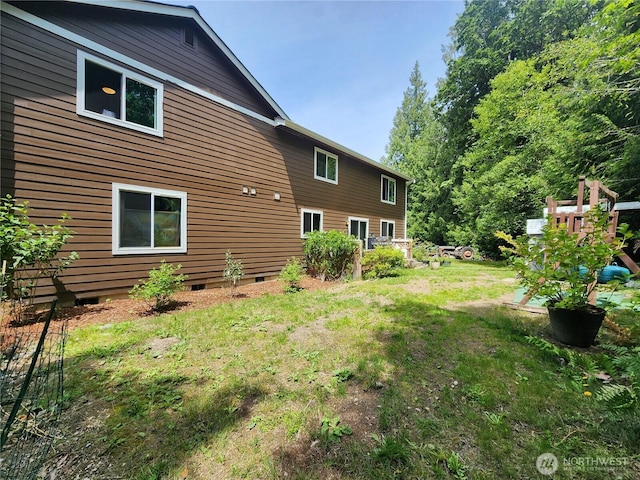 16908 61st St NW, Vaughn, WA 98394 - rear view of house with crawl space and a yard