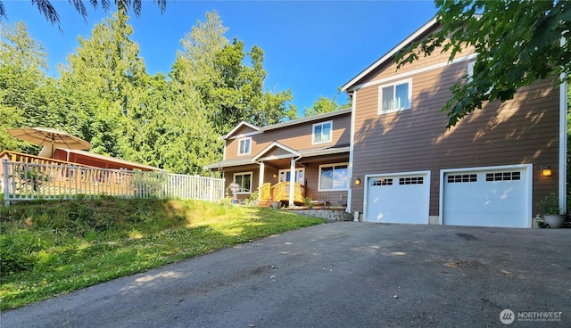 16908 61st St NW, Vaughn, WA 98394 - view of front of home with an attached garage and asphalt driveway