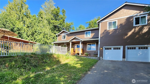 16908 61st St NW, Vaughn, WA 98394 - view of front of home with asphalt driveway, an attached garage, and covered porch